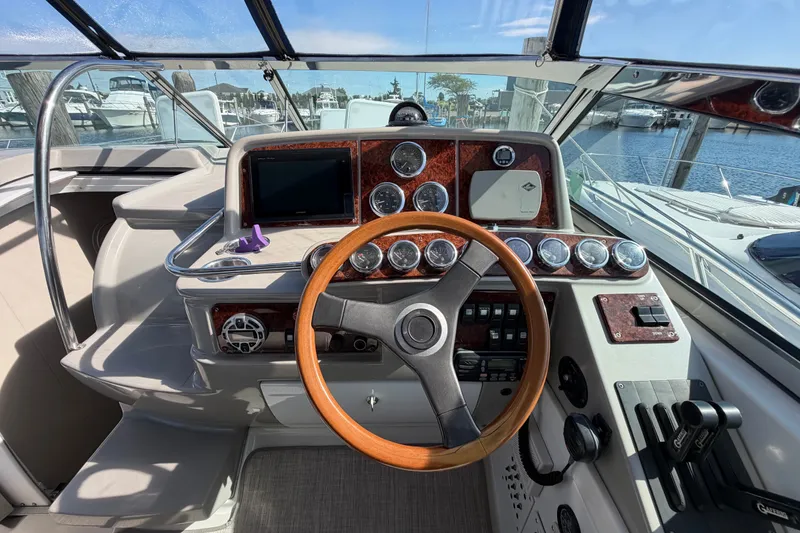 Slide: The Image of Cockpit of 2003 Formula 37 Performance Cruiser with wooden steering wheel and instrument panel. - 23