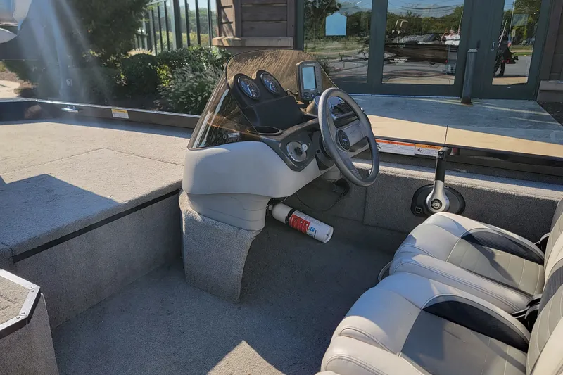 Slide: The Image of 2008 Crestliner CX 17 Bass boat interior with steering console and seating. - 6