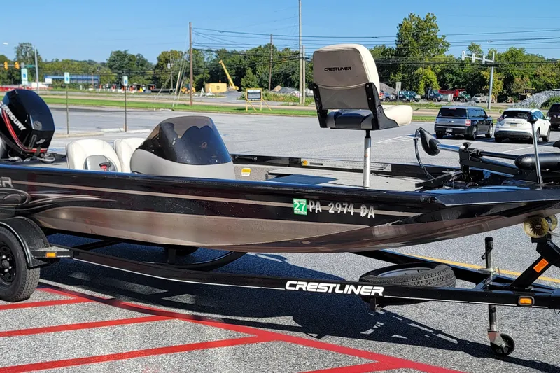 Slide: The Image of 2008 Crestliner CX 17 Bass boat on trailer in parking lot. - 1