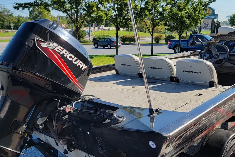 Slide: The Image of 2008 Crestliner CX 17 Bass boat with Mercury engine, parked outdoors. - 3