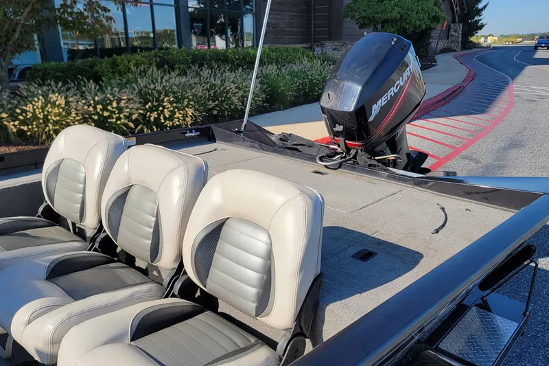 Slide: The Image of 2008 Crestliner CX 17 Bass boat with Mercury outboard motor and three seats. - 9