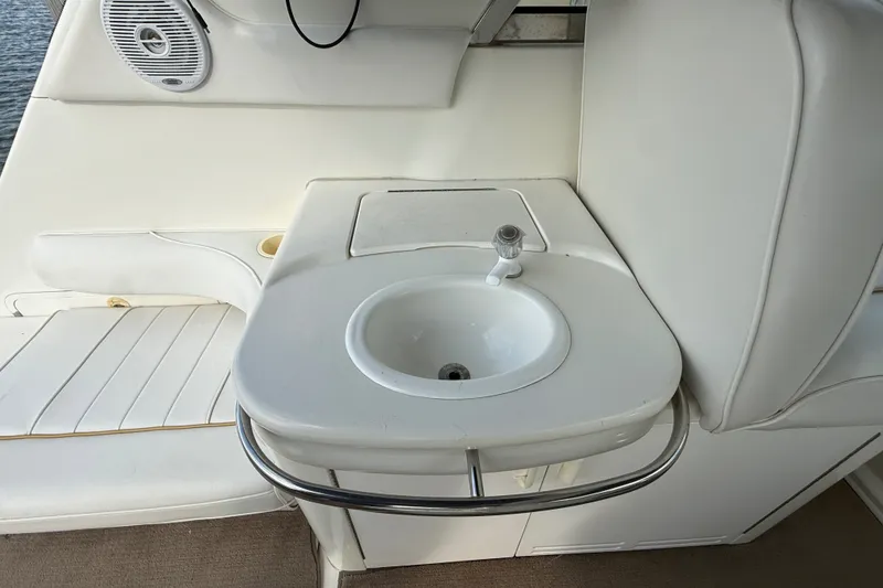 Slide: The Image of 1996 Sea Ray Sundancer 370 interior with sink and seating area. - 14