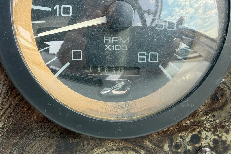 Slide: The Image of Close-up of a 1996 Sea Ray Sundancer 370 RPM gauge showing 985.6 hours. - 22