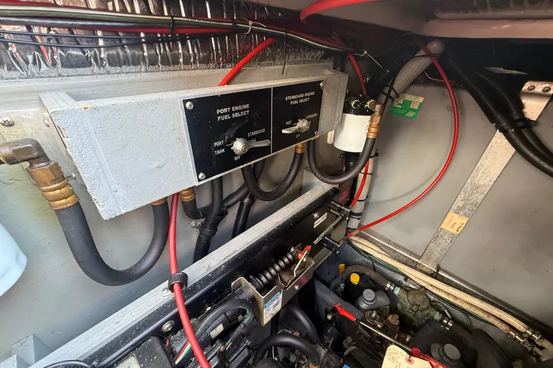 Slide: The Image of Engine room of a 1996 Sea Ray Sundancer 370 with fuel selection controls. - 71