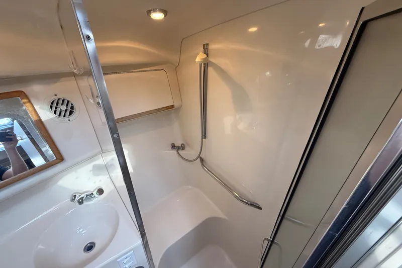 Slide: The Image of Bathroom interior of 1996 Sea Ray Sundancer 370 yacht, featuring sink and shower. - 50