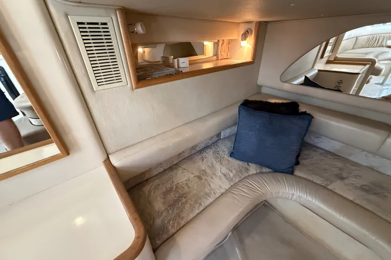 Slide: The Image of Interior of 1996 Sea Ray Sundancer 370 yacht with cozy seating and blue cushion. - 62