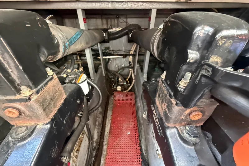 Slide: The Image of Engine compartment of a 1996 Sea Ray Sundancer 370 with visible components and hoses. - 68