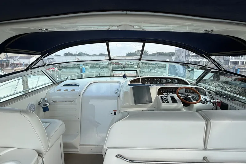 Slide: The Image of Interior view of 1996 Sea Ray Sundancer 370 yacht cockpit with steering wheel and controls. - 16