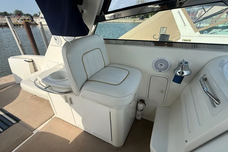 Slide: The Image of Interior of a 1996 Sea Ray Sundancer 370 boat with white seating and nautical features. - 31