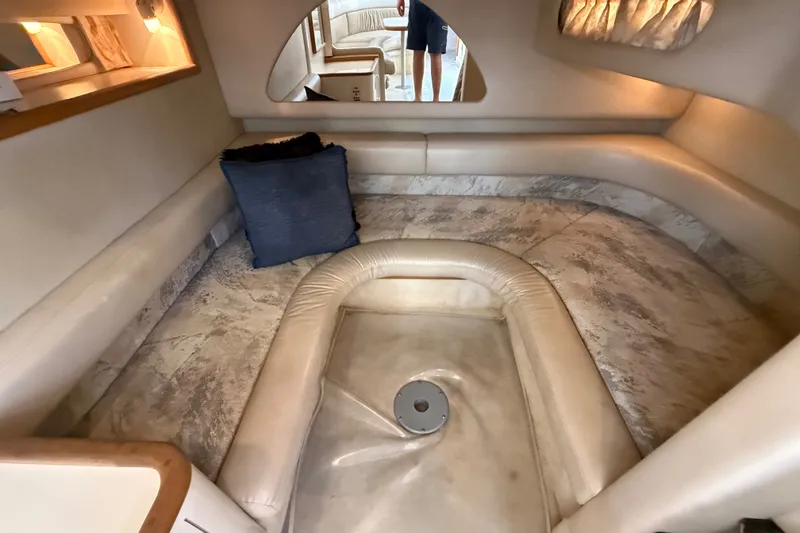 Slide: The Image of Interior of 1996 Sea Ray Sundancer 370 yacht with plush seating and cozy lighting. - 60