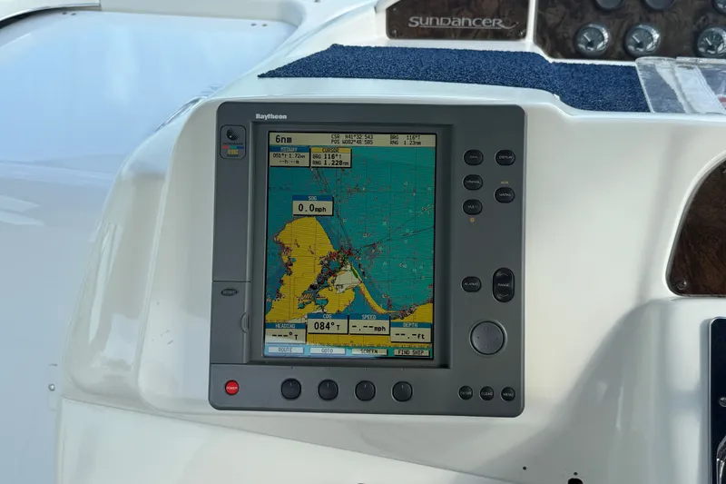 Slide: The Image of Navigation system on a 1996 Sea Ray Sundancer 370 boat dashboard. - 24