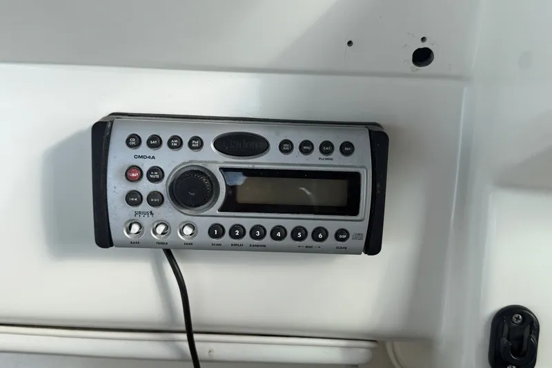 Slide: The Image of Clarion CMD4A stereo system on a 1996 Sea Ray Sundancer 370 boat dashboard. - 27