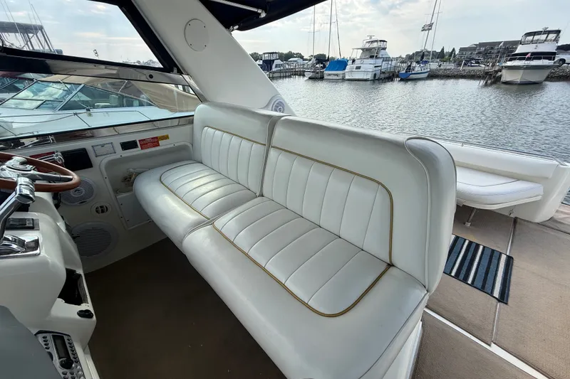 Slide: The Image of Interior of 1996 Sea Ray Sundancer 370 yacht with white leather seating. - 18