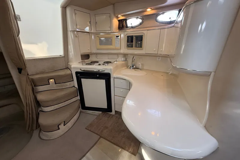 Slide: The Image of Interior of 1996 Sea Ray Sundancer 370 yacht with compact kitchen and curved countertops. - 41