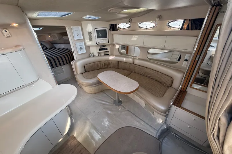 Slide: The Image of Interior of a 1996 Sea Ray Sundancer 370 yacht with cozy seating and modern amenities. - 34