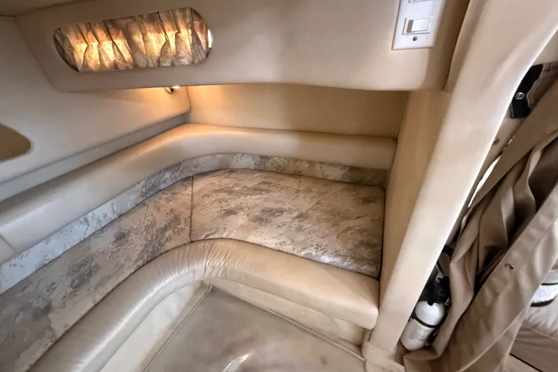 Slide: The Image of 1996 Sea Ray Sundancer 370 cabin interior with beige seating and ambient lighting. - 61