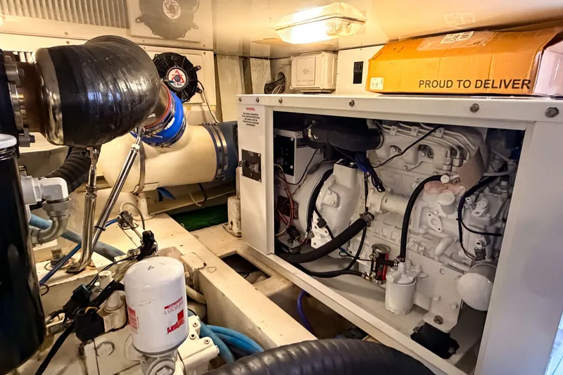 Slide: The Image of Engine room of a 2003 Viking 48 Convertible yacht, showcasing machinery and components. - 31
