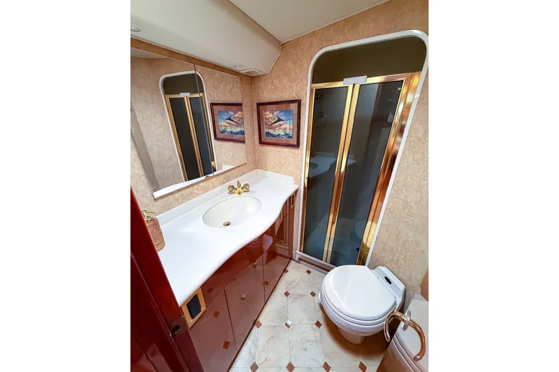 Slide: The Image of Luxurious bathroom in 2003 Viking 48 Convertible yacht with shower and elegant fixtures. - 21