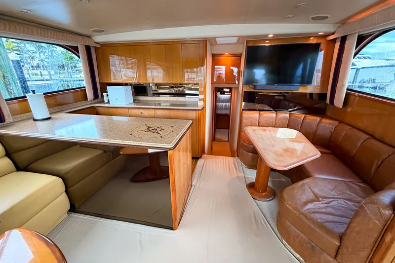 Slide: The Image of Luxurious interior of a 2003 Viking 48 Convertible yacht with leather seating and modern amenities. - 15