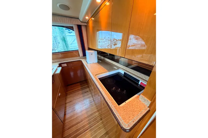 Slide: The Image of Luxurious kitchen interior of 2003 Viking 48 Convertible yacht with modern appliances. - 24