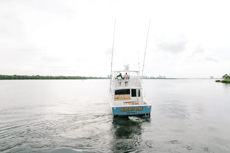 Slide: The Image of 2003 Viking 48 Convertible yacht cruising on calm waters. - 8
