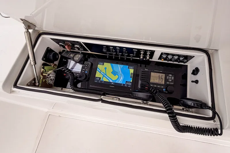 Slide: The Image of 2003 Viking 48 Convertible boat navigation and communication equipment panel. - 28