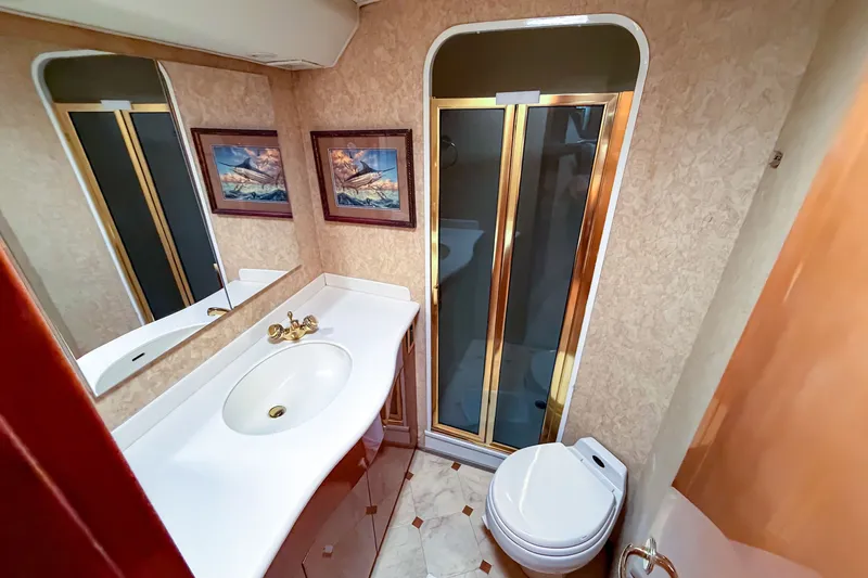 Slide: The Image of Luxurious bathroom in 2003 Viking 48 Convertible yacht with shower and elegant fixtures. - 20