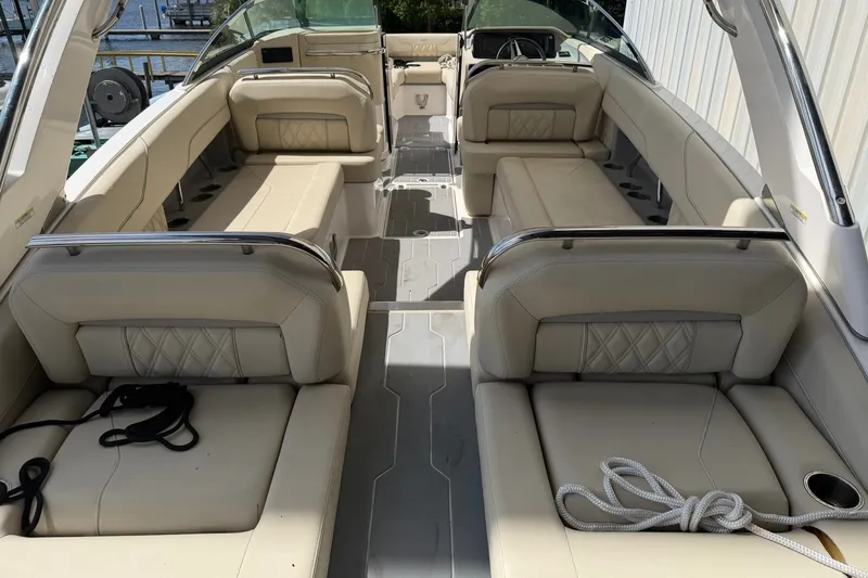 Slide: The Image of Luxurious interior of a 2019 Regal LS6 boat with beige seating and ropes. - 18