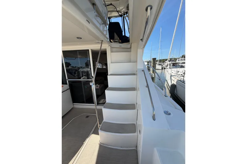 Slide: The Image of Staircase on 2012 Sea Ray 450 Sedan Bridge yacht, leading to upper deck. - 47