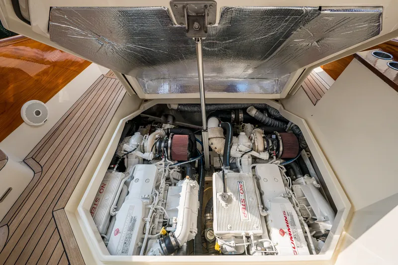 Slide: The Image of Engine compartment of 2022 Hinckley Picnic Boat 40, showcasing twin engines and detailed components. - 17