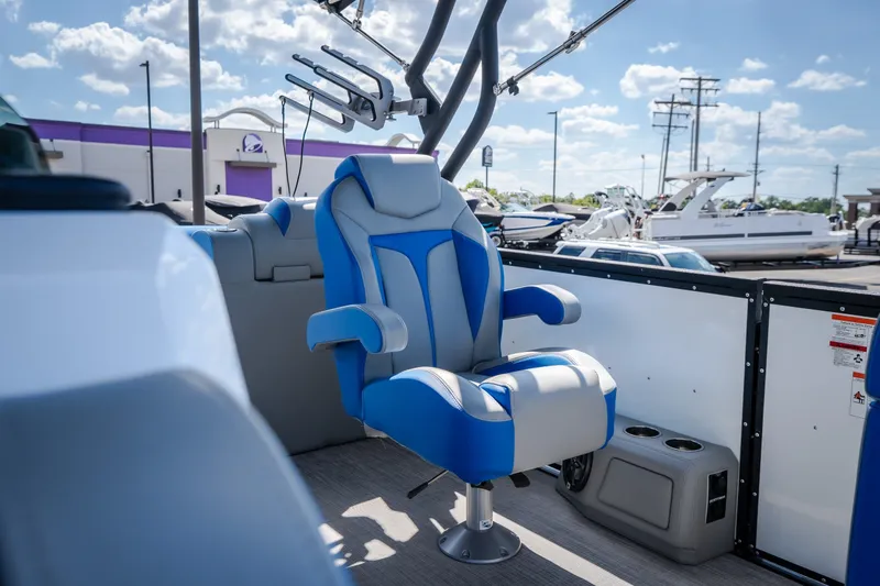 Slide: The Image of 2025 Montara 25 Surf Boss boat interior with blue captain's chair and modern design. - 25
