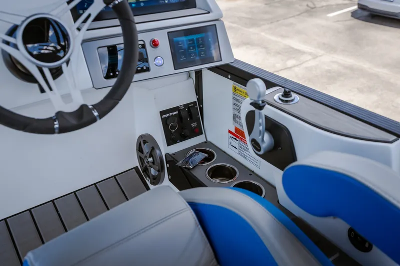 Slide: The Image of Interior of 2025 Montara 25 Surf Boss boat with steering wheel and control panel. - 45