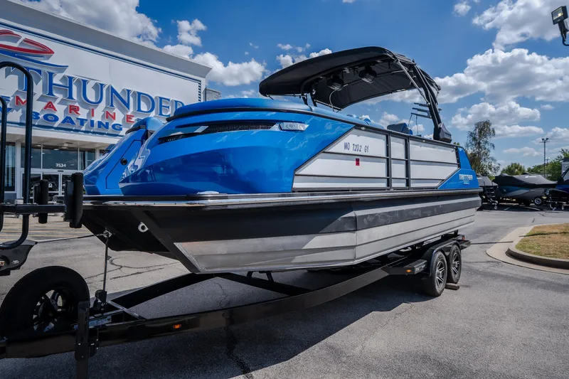 Slide: The Image of 2025 Montara 25 Surf Boss boat on trailer at Thunder Marine dealership. - 2