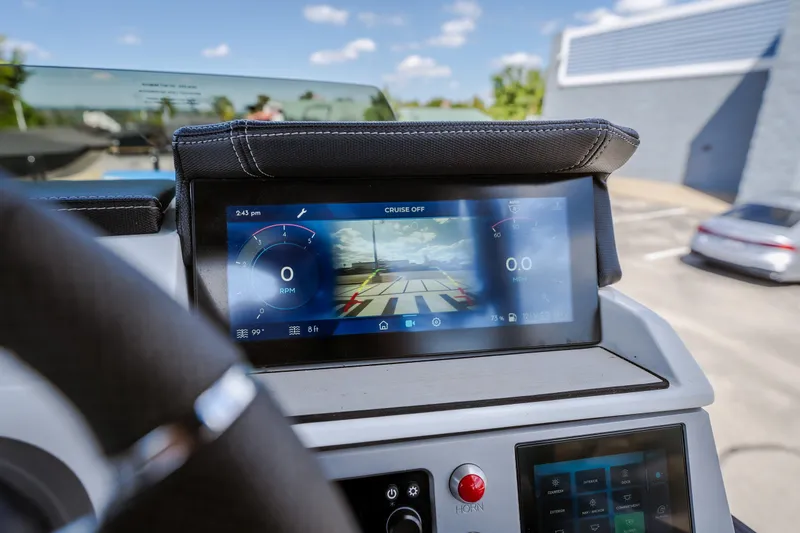 Slide: The Image of Dashboard of 2025 Montara 25 Surf Boss boat with digital display and controls. - 32