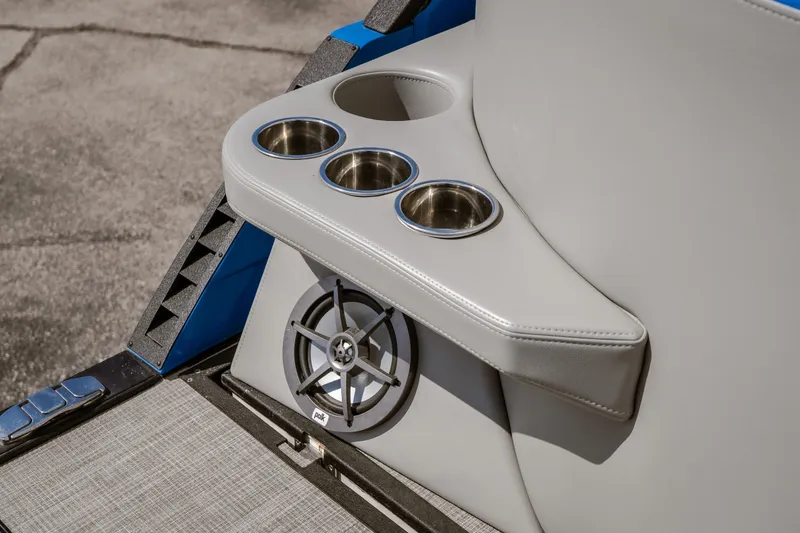 Slide: The Image of 2025 Montara 25 Surf Boss boat interior with cup holders and speaker. - 40