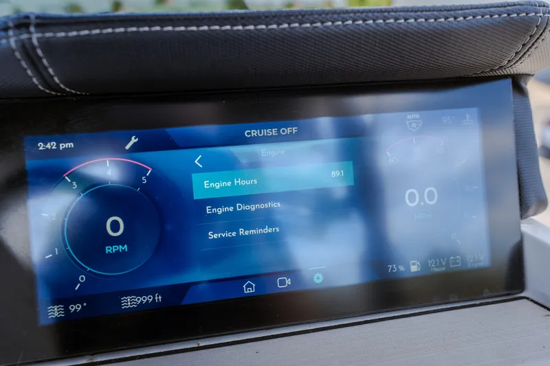 Slide: The Image of Dashboard display of 2025 Montara 25 Surf Boss showing engine diagnostics and service reminders. - 31