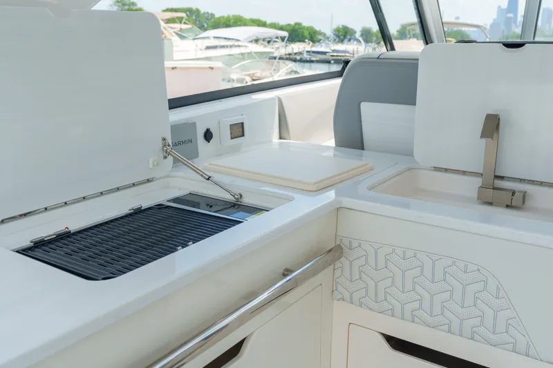 Slide: The Image of 2023 Regal LS36 yacht interior with modern kitchen amenities and sleek design. - 35