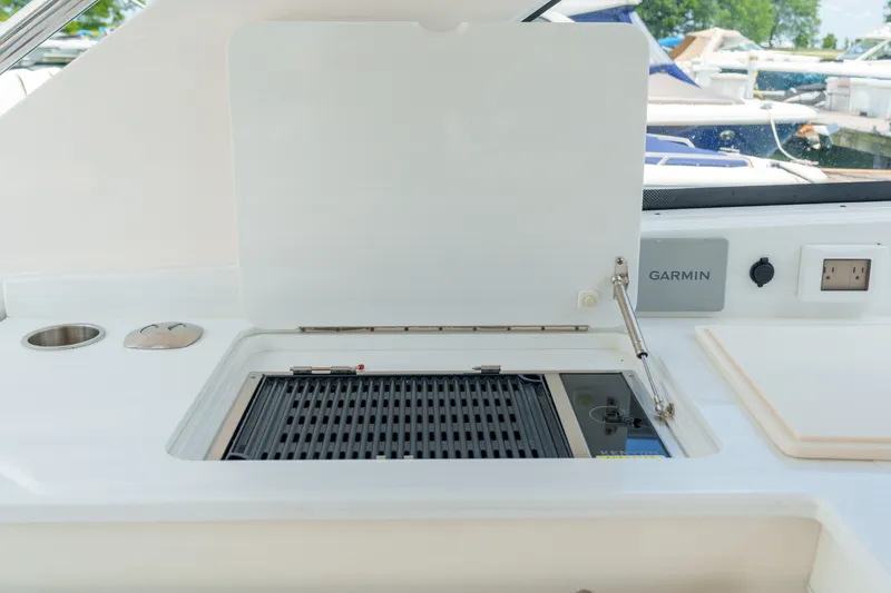 Slide: The Image of 2023 Regal LS36 yacht grill station with Garmin panel and power outlet. - 36
