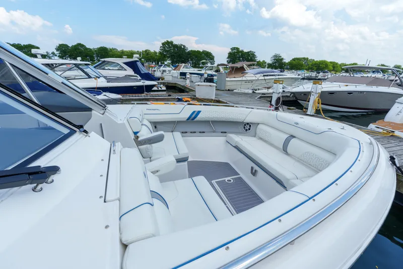 Slide: The Image of 2023 Regal LS36 luxury boat interior at marina, featuring spacious seating and sleek design. - 32