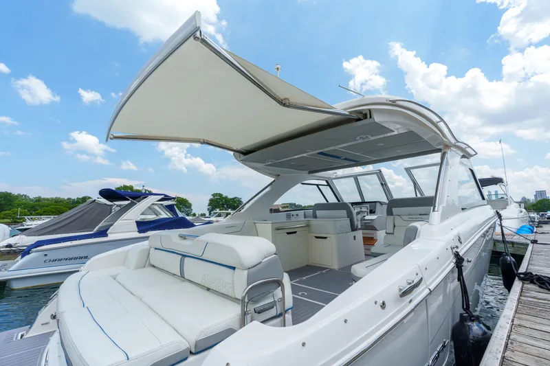 Slide: The Image of 2023 Regal LS36 luxury boat docked, featuring spacious seating and modern design. - 39