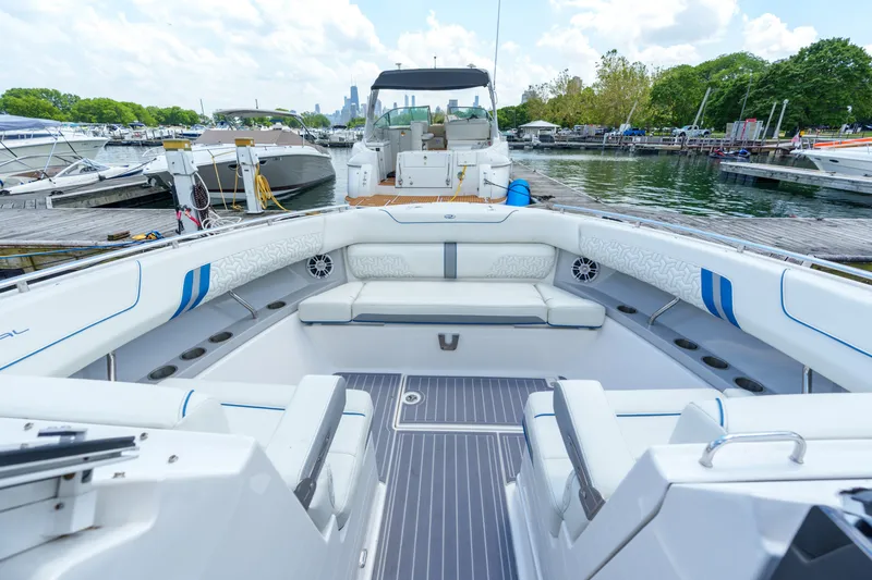 Slide: The Image of 2023 Regal LS36 boat interior at marina, featuring spacious seating and modern design. - 30