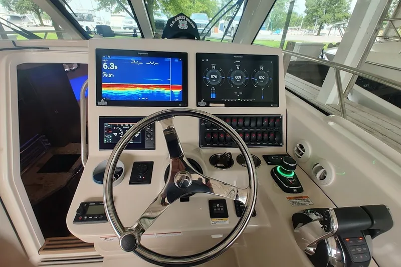 Slide: The Image of Control panel of a 2020 Boston Whaler 345 Conquest boat with advanced navigation displays. - 17