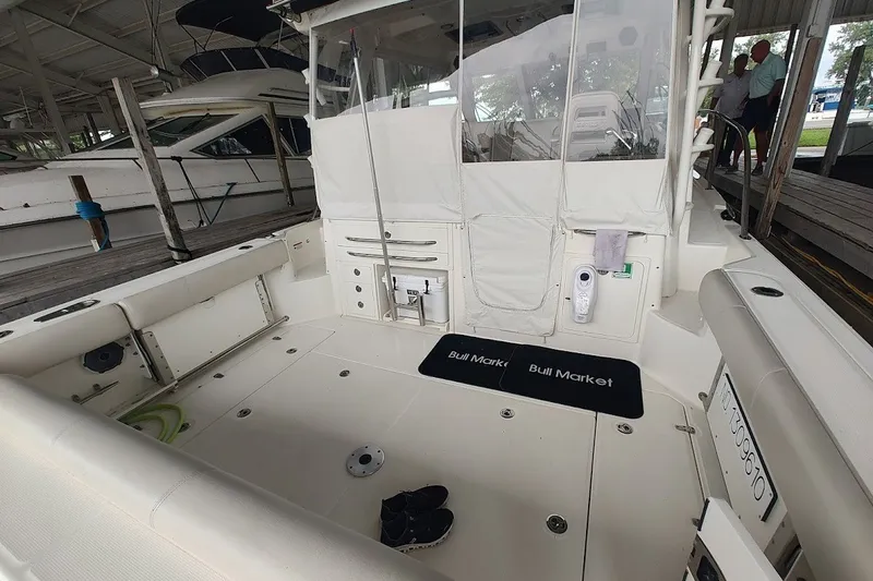 Slide: The Image of 2020 Boston Whaler 345 Conquest boat interior with seating and equipment, docked in a marina. - 21