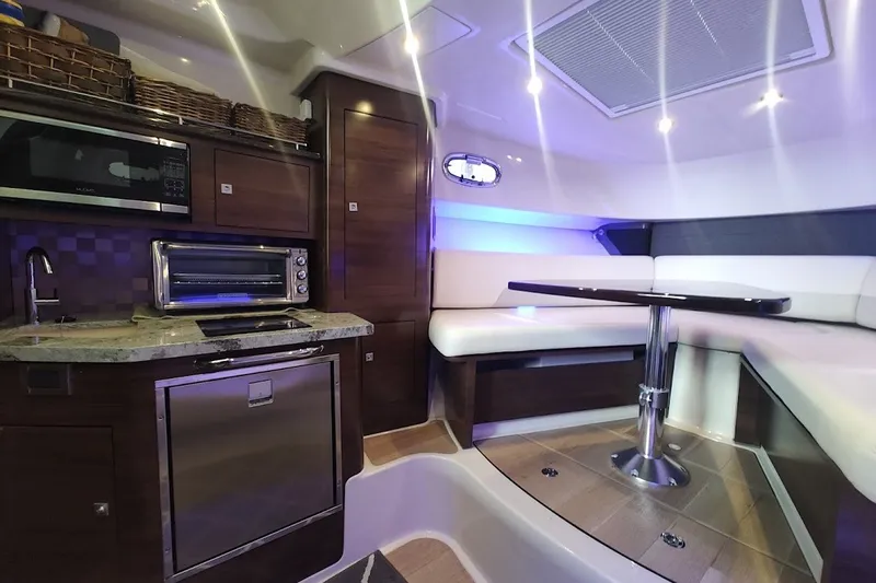 Slide: The Image of Luxurious interior of 2020 Boston Whaler 345 Conquest with modern kitchen and seating area. - 23