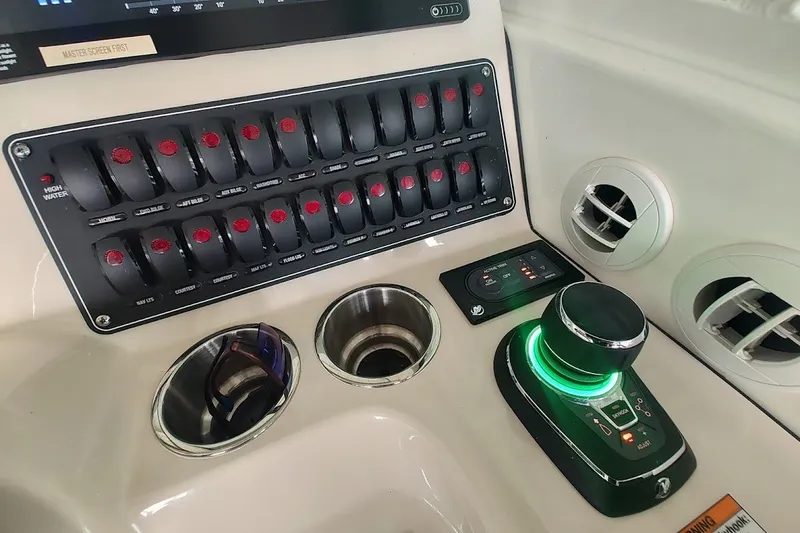 Slide: The Image of Control panel of a 2020 Boston Whaler 345 Conquest boat cockpit. - 16