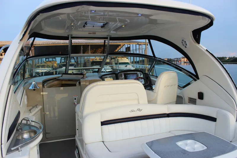 Slide: The Image of 2006 Sea Ray 40 Sundancer yacht interior with helm, seating, and table. - 11