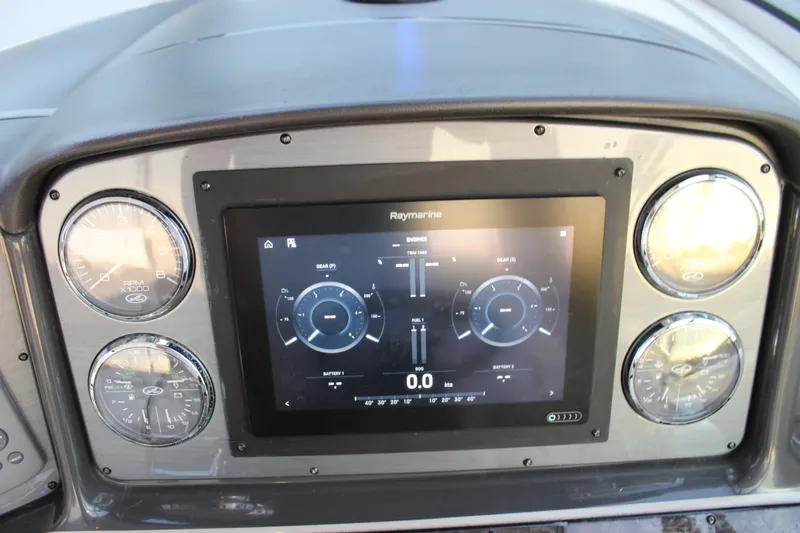 Slide: The Image of Dashboard of a 2006 Sea Ray 40 Sundancer with Raymarine display and gauges. - 53