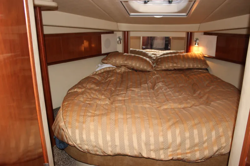 Slide: The Image of Luxurious cabin interior of 2006 Sea Ray 40 Sundancer yacht with cozy bedding. - 29