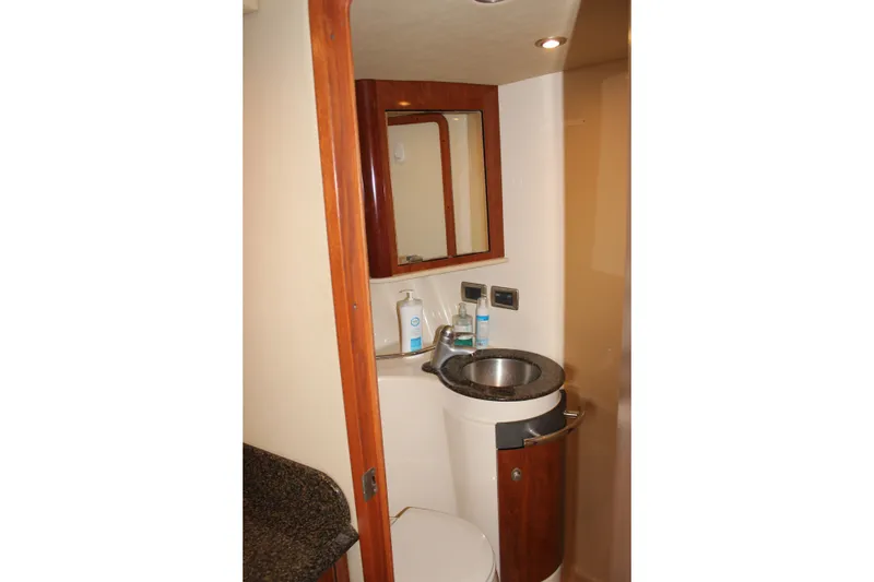 Slide: The Image of Bathroom interior of 2006 Sea Ray 40 Sundancer yacht with sink and mirror. - 43