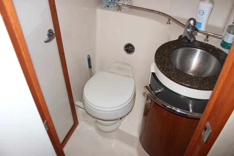 Slide: The Image of Bathroom interior of 2006 Sea Ray 40 Sundancer yacht with toilet and sink. - 39